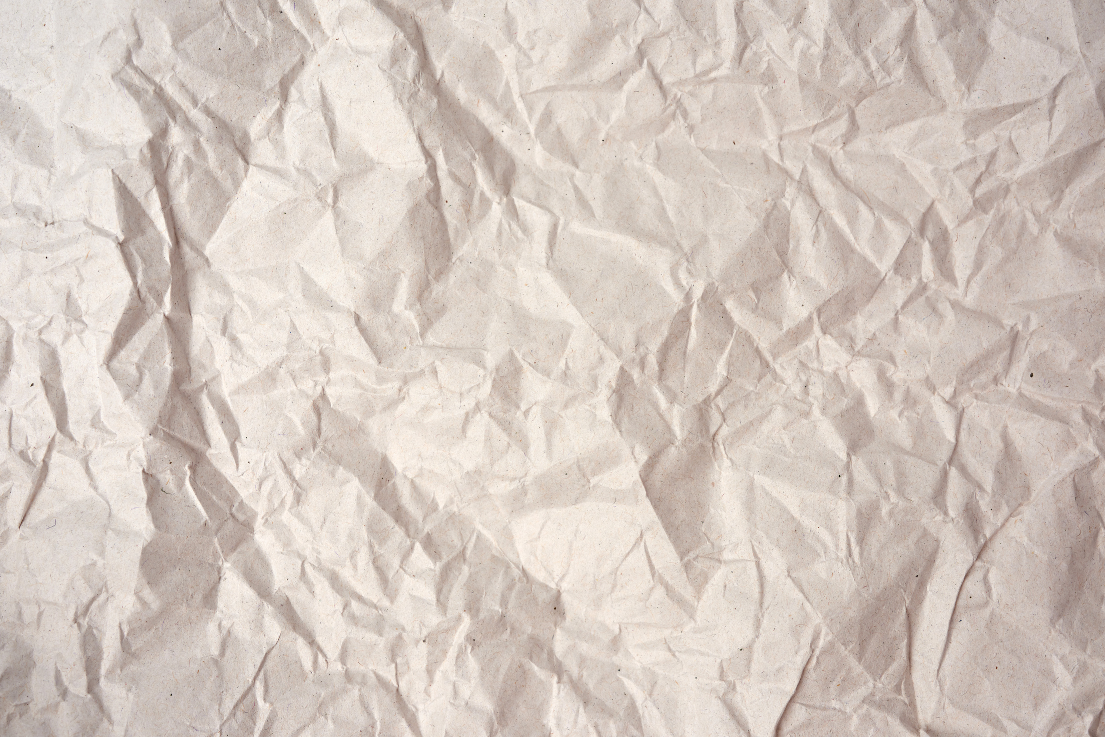Crumpled Blank Sheet of Gray Wrapping Kraft Paper